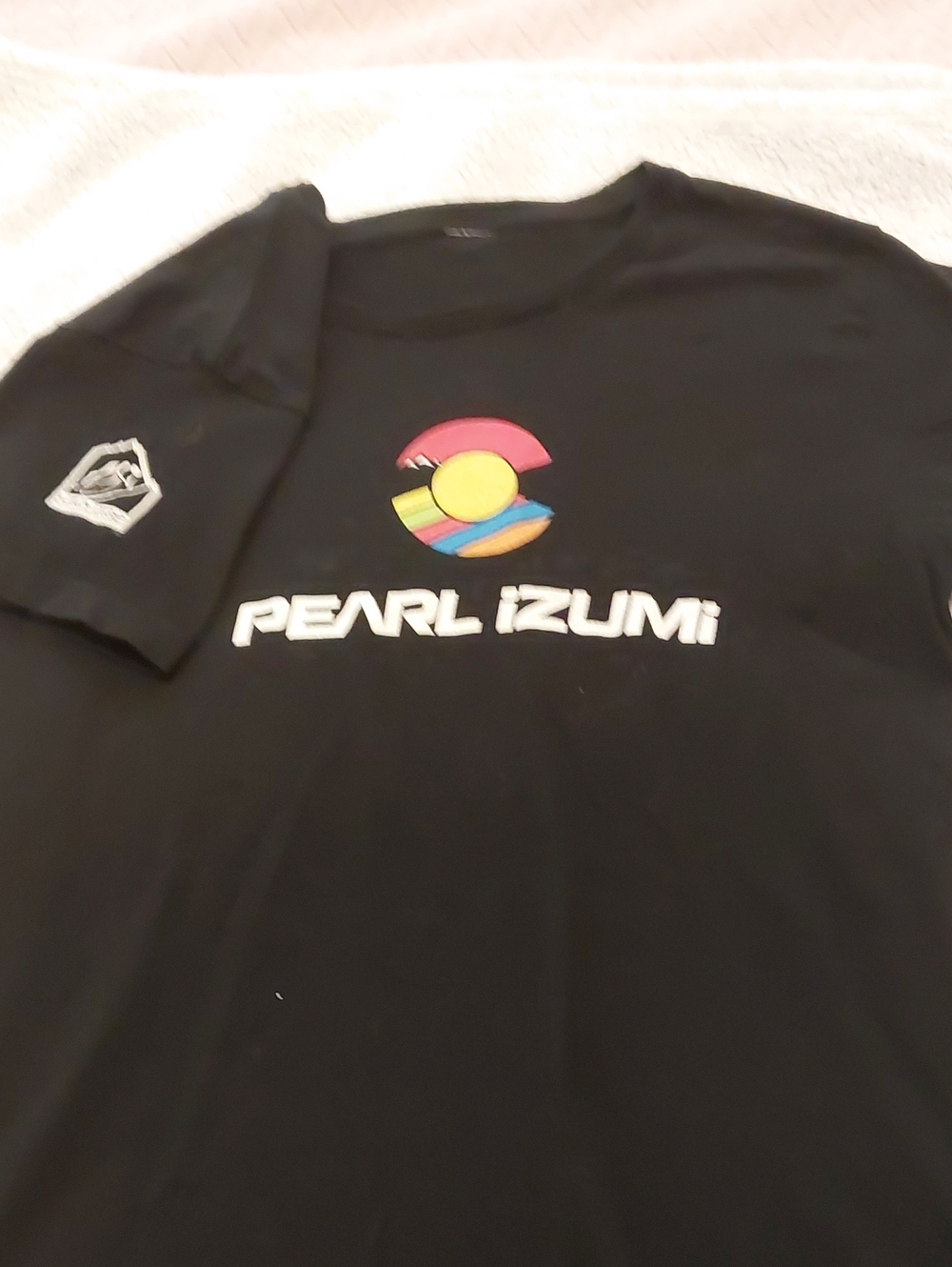 Pearl Izumi Black Tee with Rainbow Circle Logo